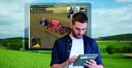 Agriculteur utilisant les service KUHN CCI Connect depuis une tablette