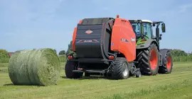 A VB 3165 round baler with a freshly ejected bale behind it