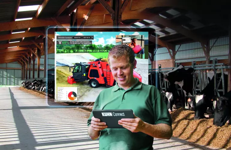 Photo illustrant un éleveur qui utilise l'application KUHN Connect
